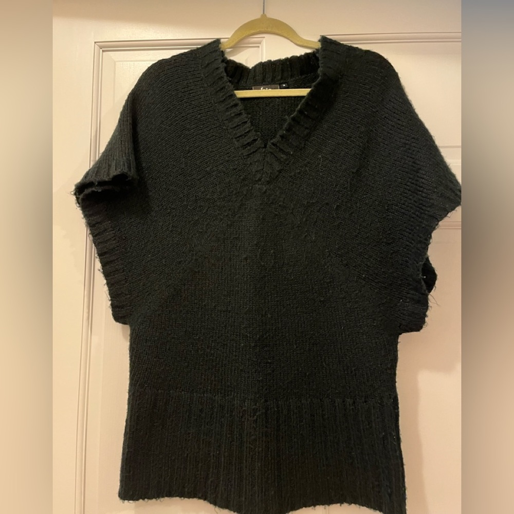 Black knit sweater, wide fit looks like size S/M, versatile to use as a vest